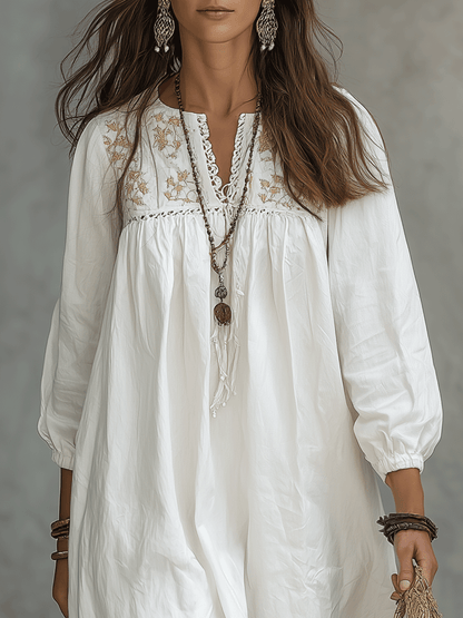Vestido maxi blanco bohemio con bordado de flores y mangas globo
